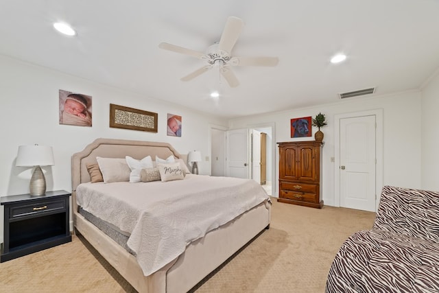 carpeted bedroom featuring crown molding and ceiling fan