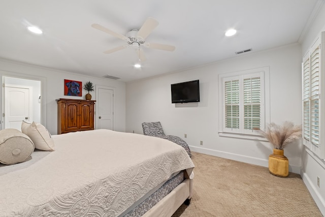 bedroom featuring ceiling fan, light carpet, ornamental molding, and multiple windows