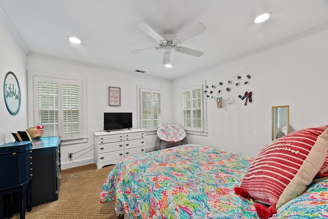 bedroom with light carpet, ornamental molding, and ceiling fan