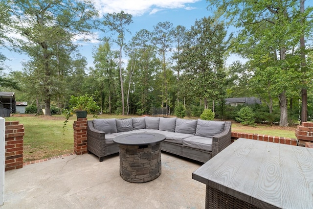 view of patio / terrace featuring an outdoor living space with a fire pit