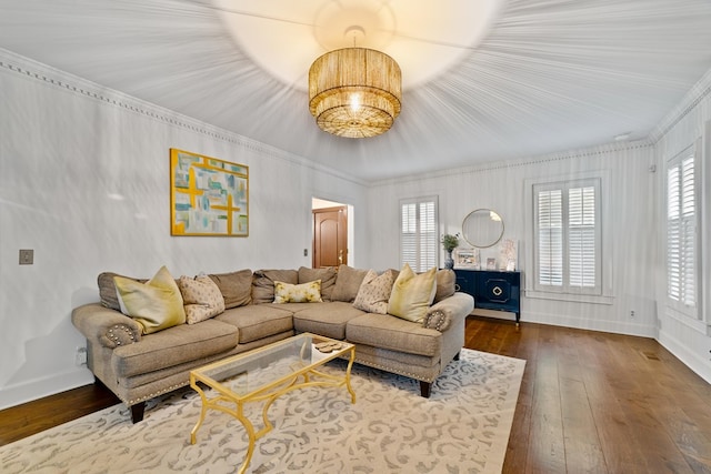 living room featuring ornamental molding and dark hardwood / wood-style flooring