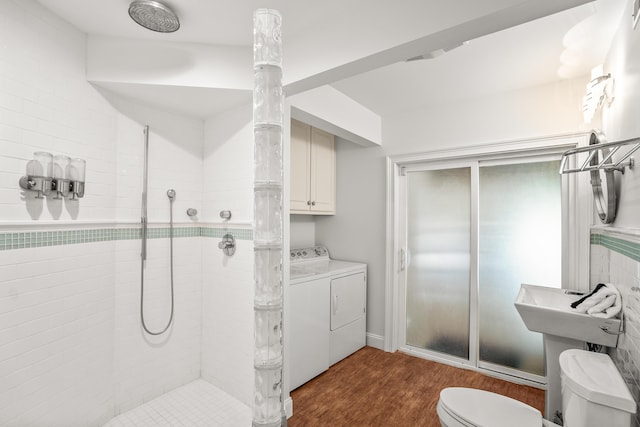 12 Port Tack, Hilton Head Island, SC 29928 - bathroom with tiled shower, wood finished floors, washing machine and clothes dryer, and toilet