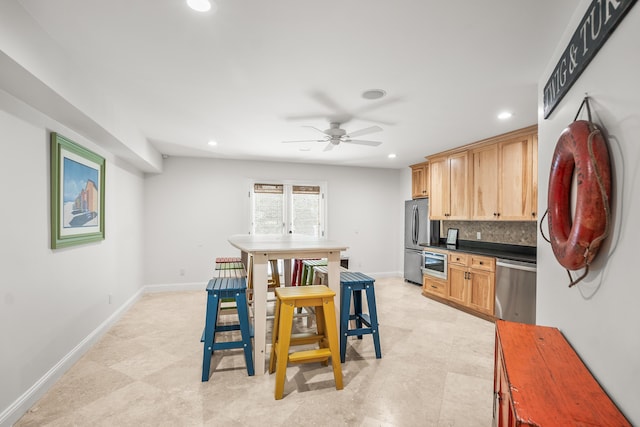 12 Port Tack, Hilton Head Island, SC 29928 - kitchen featuring stainless steel appliances, recessed lighting, dark countertops, a ceiling fan, and backsplash