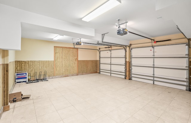 12 Port Tack, Hilton Head Island, SC 29928 - garage featuring wainscoting, a garage door opener, and wooden walls