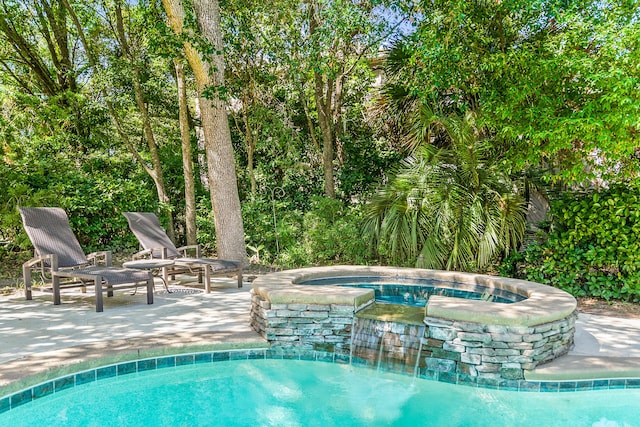 12 Port Tack, Hilton Head Island, SC 29928 - view of swimming pool featuring a patio and a pool with connected hot tub
