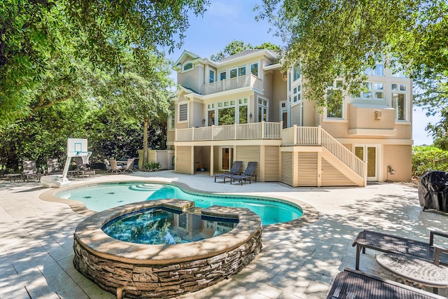 12 Port Tack, Hilton Head Island, SC 29928 - view of pool featuring stairway, a patio, and a pool with connected hot tub