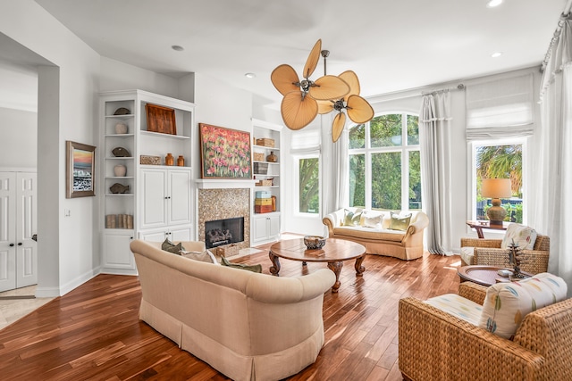 12 Port Tack, Hilton Head Island, SC 29928 - living area with a tiled fireplace, wood-type flooring, ceiling fan, recessed lighting, and baseboards