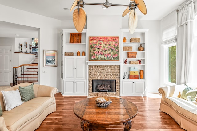 12 Port Tack, Hilton Head Island, SC 29928 - living area featuring wood finished floors, a ceiling fan, stairs, and a fireplace