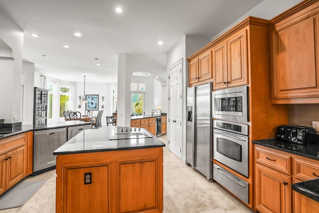 12 Port Tack, Hilton Head Island, SC 29928 - kitchen featuring stainless steel appliances, a warming drawer, a center island, recessed lighting, and brown cabinets
