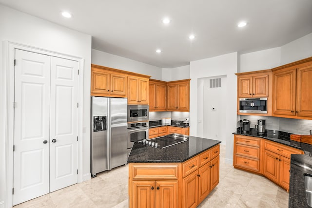 12 Port Tack, Hilton Head Island, SC 29928 - kitchen featuring appliances with stainless steel finishes, decorative backsplash, a kitchen island, dark stone countertops, and recessed lighting