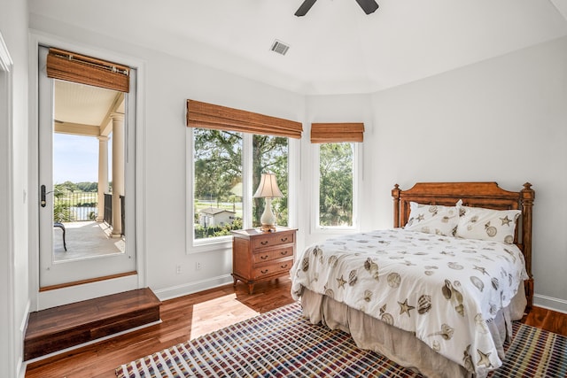 12 Port Tack, Hilton Head Island, SC 29928 - bedroom featuring access to exterior, wood finished floors, baseboards, and a ceiling fan