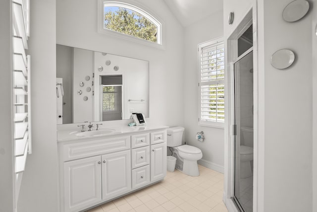 12 Port Tack, Hilton Head Island, SC 29928 - bathroom featuring toilet, vanity, a stall shower, lofted ceiling, and tile patterned flooring