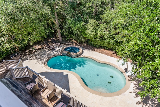 12 Port Tack, Hilton Head Island, SC 29928 - view of pool featuring a patio, a wooden deck, and a pool with connected hot tub