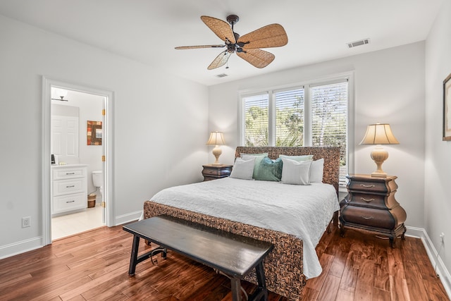 12 Port Tack, Hilton Head Island, SC 29928 - bedroom featuring wood finished floors, baseboards, ensuite bath, and a ceiling fan