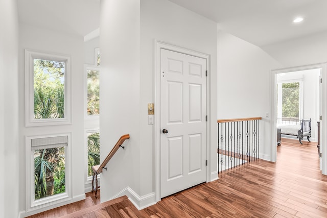 12 Port Tack, Hilton Head Island, SC 29928 - foyer entrance with wood finished floors, baseboards, recessed lighting, and lofted ceiling