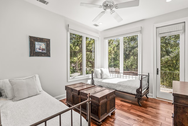 12 Port Tack, Hilton Head Island, SC 29928 - bedroom with access to outside, wood finished floors, baseboards, recessed lighting, and a ceiling fan