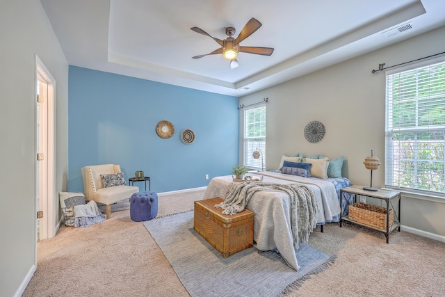 7690 High Maple Cir N, Charleston, SC 29418 - carpeted bedroom with a raised ceiling, baseboards, and a ceiling fan