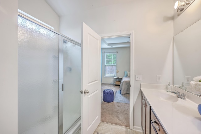 7690 High Maple Cir N, Charleston, SC 29418 - ensuite bathroom featuring a shower stall, vanity, and tile patterned flooring