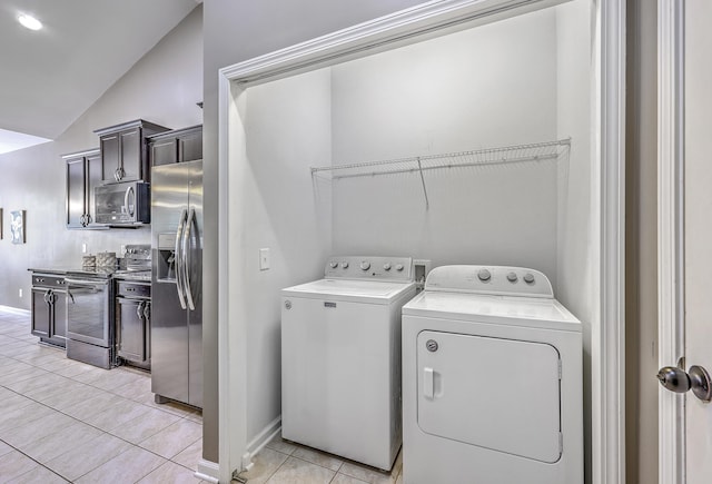 7690 High Maple Cir N, Charleston, SC 29418 - clothes washing area featuring washer and clothes dryer, baseboards, and light tile patterned flooring