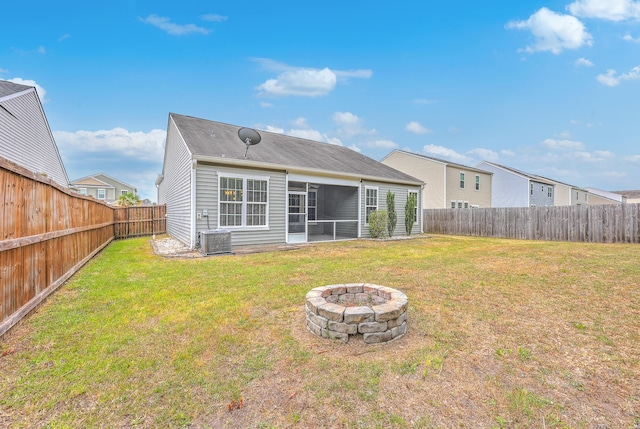 7690 High Maple Cir N, Charleston, SC 29418 - rear view of property featuring an outdoor fire pit, a sunroom, and central AC unit
