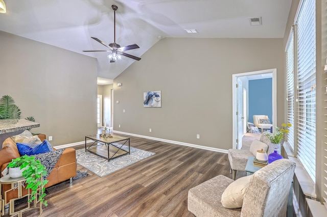 7690 High Maple Cir N, Charleston, SC 29418 - living area featuring vaulted ceiling, wood finished floors, a ceiling fan, and baseboards