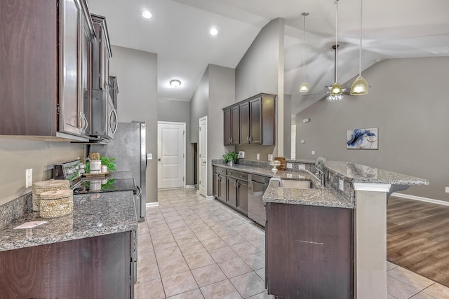 7690 High Maple Cir N, Charleston, SC 29418 - kitchen featuring a peninsula, lofted ceiling, dark brown cabinetry, a sink, and dishwashing machine