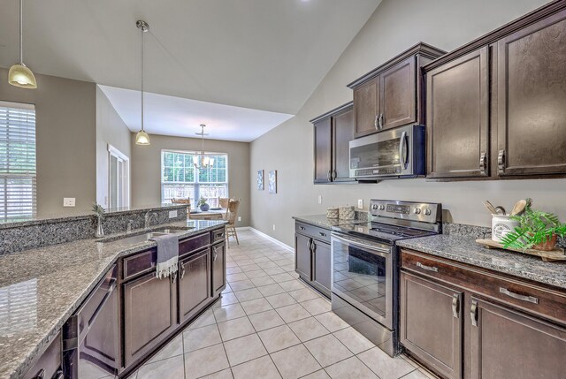 7690 High Maple Cir N, Charleston, SC 29418 - kitchen featuring stainless steel appliances, a sink, dark brown cabinetry, pendant lighting, and stone countertops