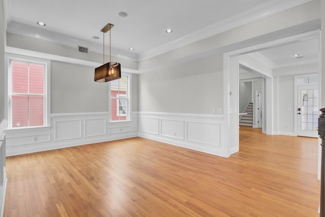 spare room featuring visible vents, stairway, crown molding, light wood-style floors, and recessed lighting