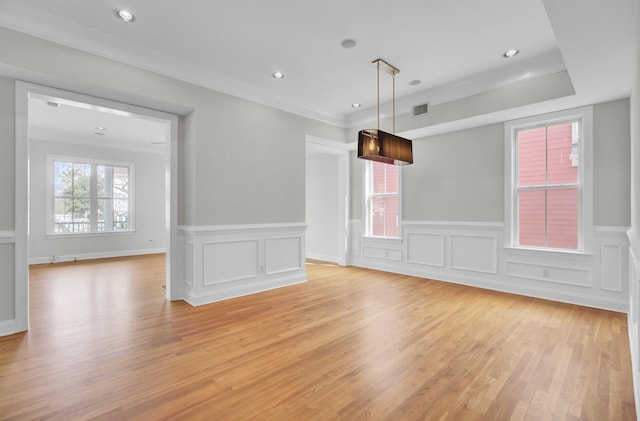 empty room with recessed lighting, visible vents, crown molding, and light wood-style flooring