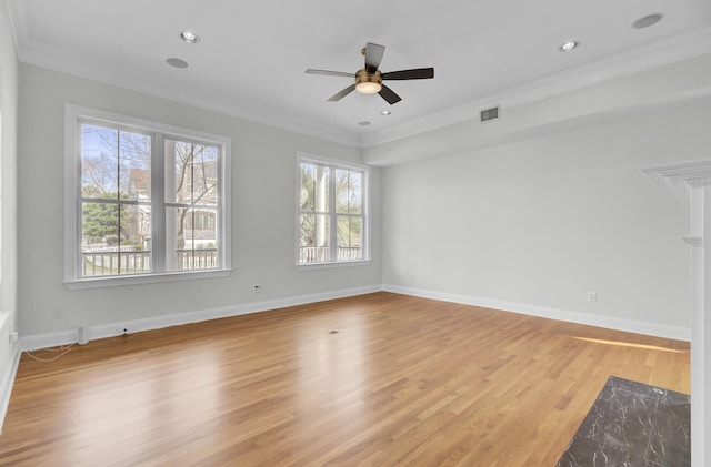 unfurnished room featuring visible vents, crown molding, and light wood finished floors