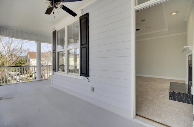 view of patio with ceiling fan and a porch