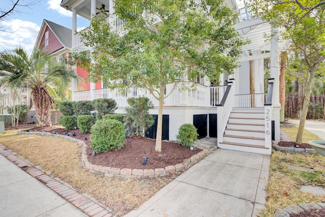 view of front of property with stairs