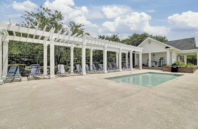 pool with a patio area, fence, and a pergola