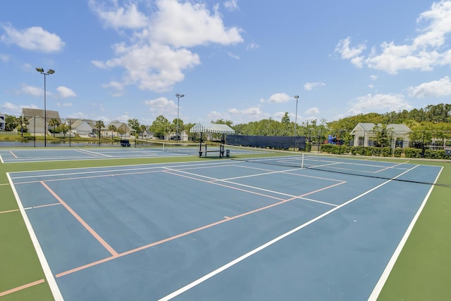 view of sport court with fence