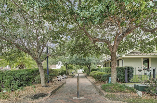 view of property's community featuring fence