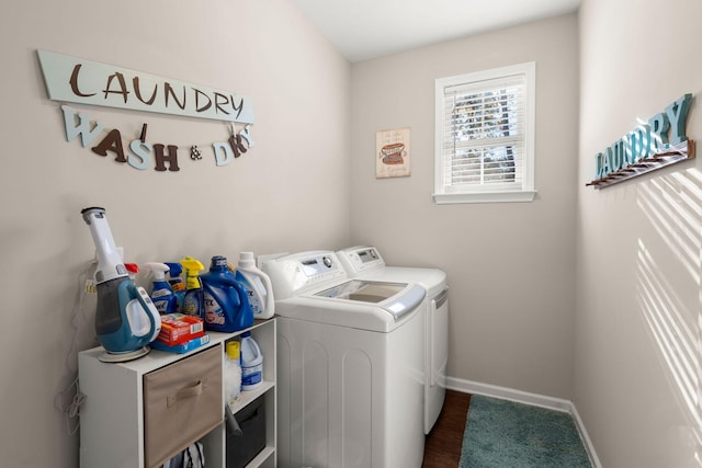 laundry room with dark hardwood / wood-style floors and washer and clothes dryer