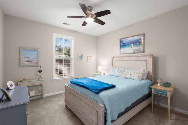 bedroom with ceiling fan and light colored carpet