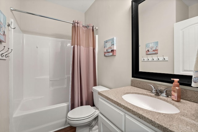 full bathroom with shower / tub combo with curtain, vanity, and toilet