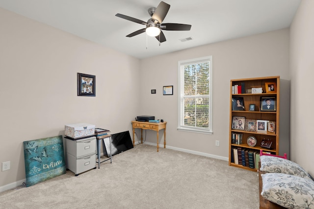 sitting room with light carpet and ceiling fan