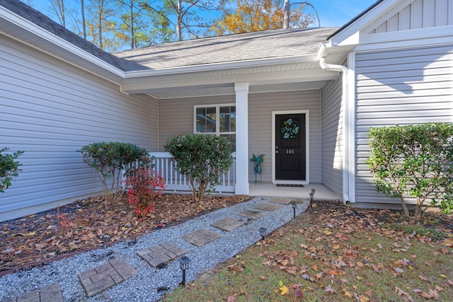 doorway to property featuring a porch