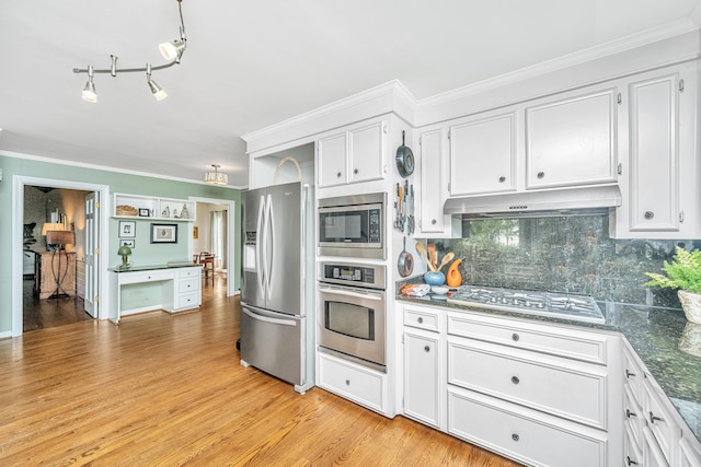 kitchen with white cabinetry, backsplash, ornamental molding, stainless steel appliances, and light hardwood / wood-style flooring