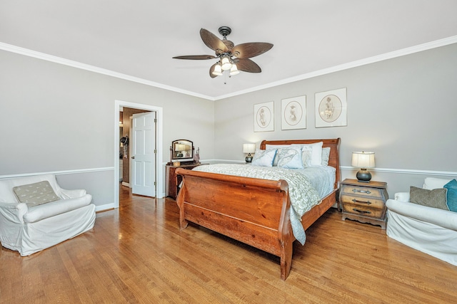 bedroom with crown molding, ceiling fan, and light wood-type flooring