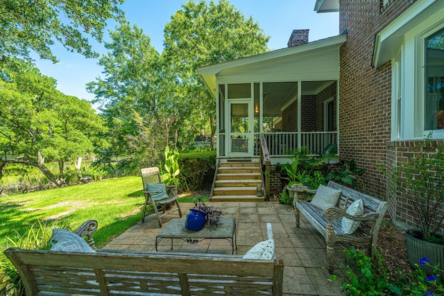 view of patio featuring an outdoor living space and a sunroom