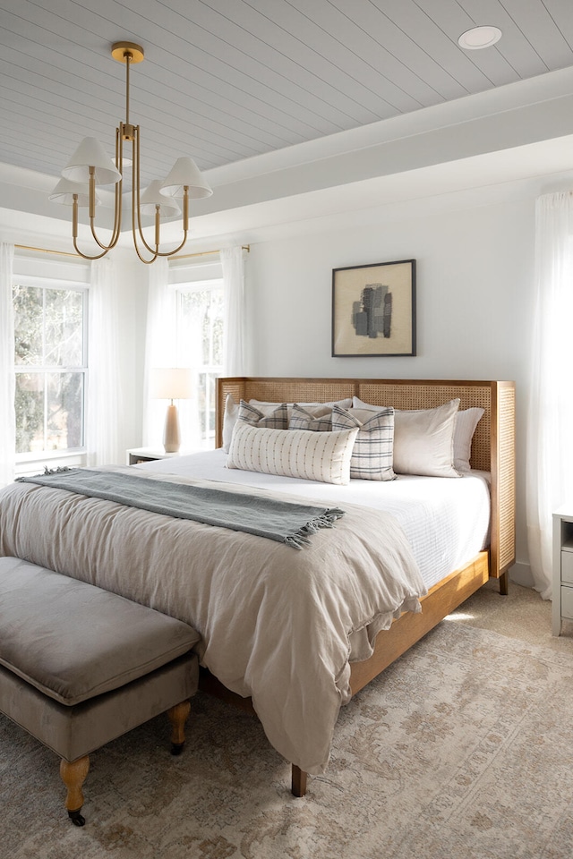 carpeted bedroom featuring wooden ceiling