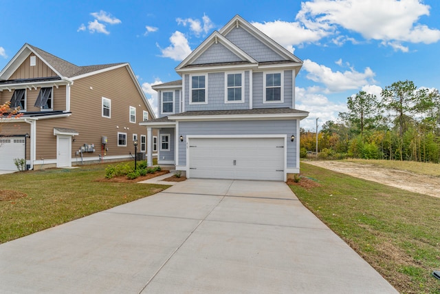 view of front of home with a garage and a front lawn