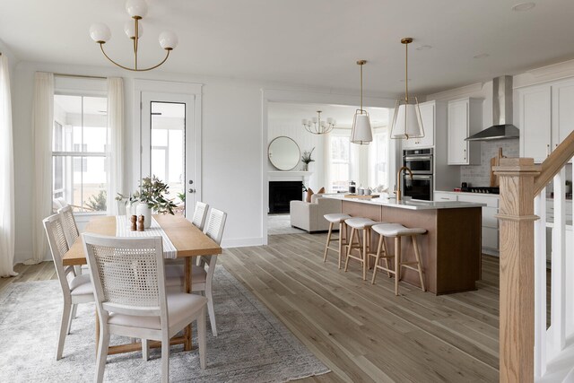 dining space with a chandelier and dark hardwood / wood-style floors