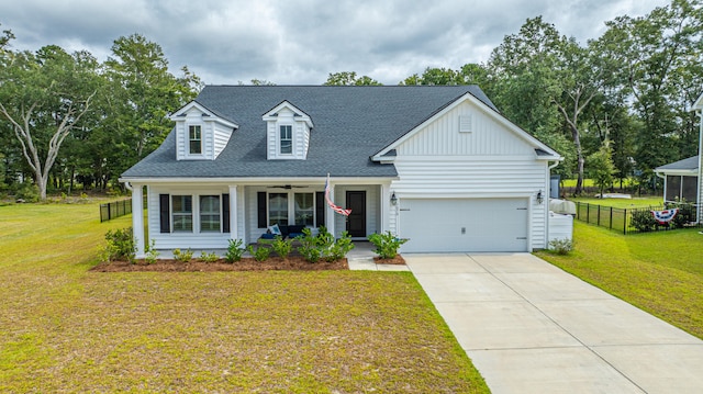 view of front of property with a garage, a porch, and a front lawn