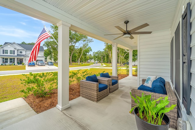 view of patio featuring ceiling fan and a porch