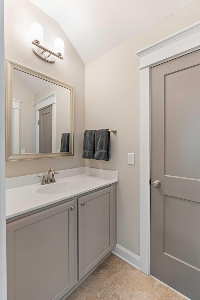 3726 Orion Ln, Mount Pleasant, SC 29466 - bathroom featuring vaulted ceiling, baseboards, and vanity