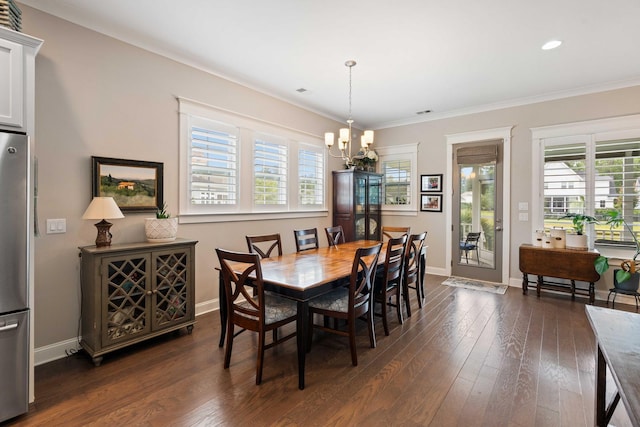 3726 Orion Ln, Mount Pleasant, SC 29466 - dining area with a chandelier, plenty of natural light, dark wood finished floors, crown molding, and recessed lighting